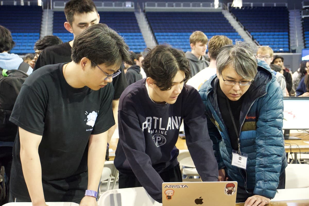 Mentor guiding a team through debugging