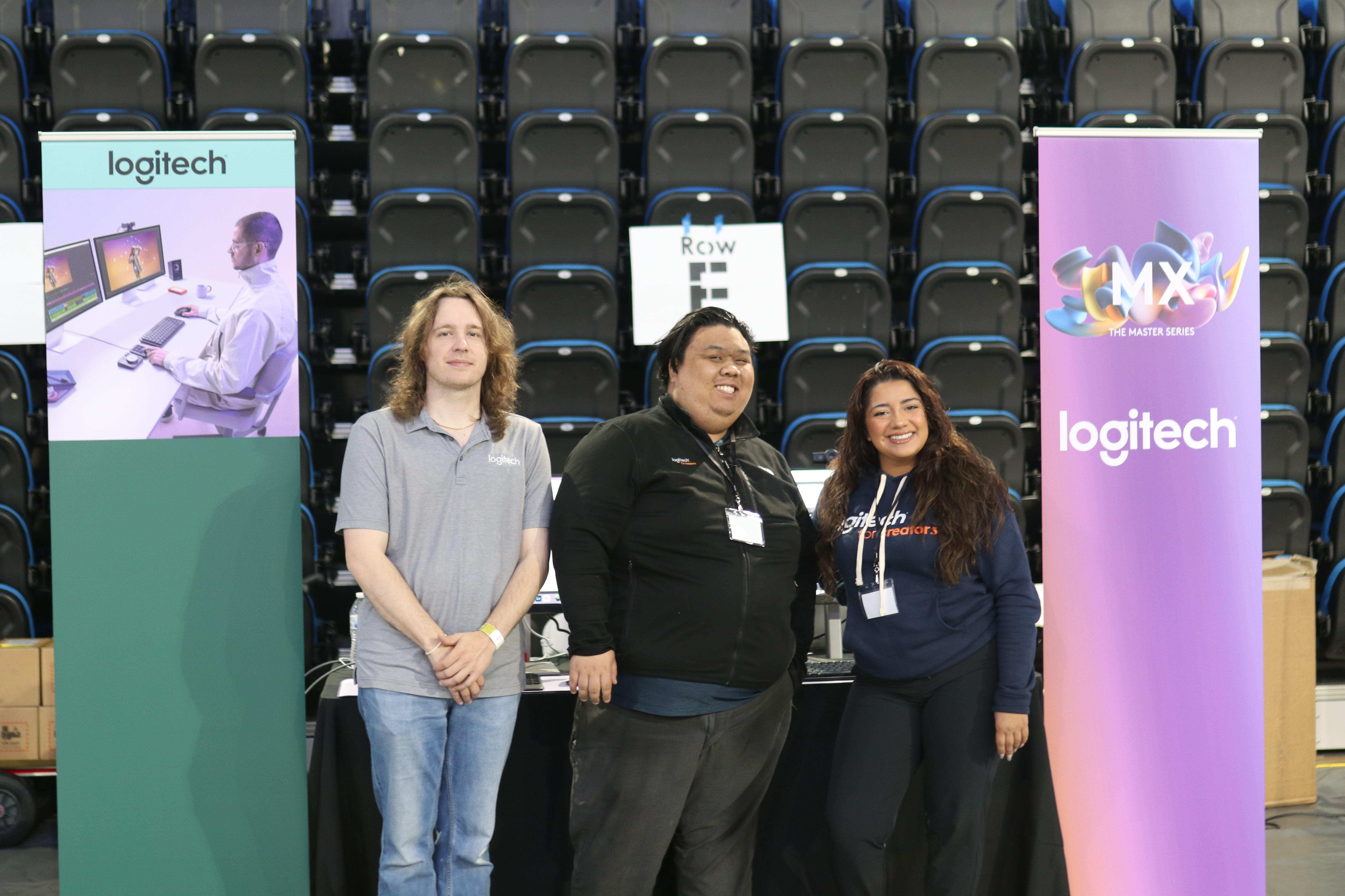 Logitech team demoing products at their hackathon booth