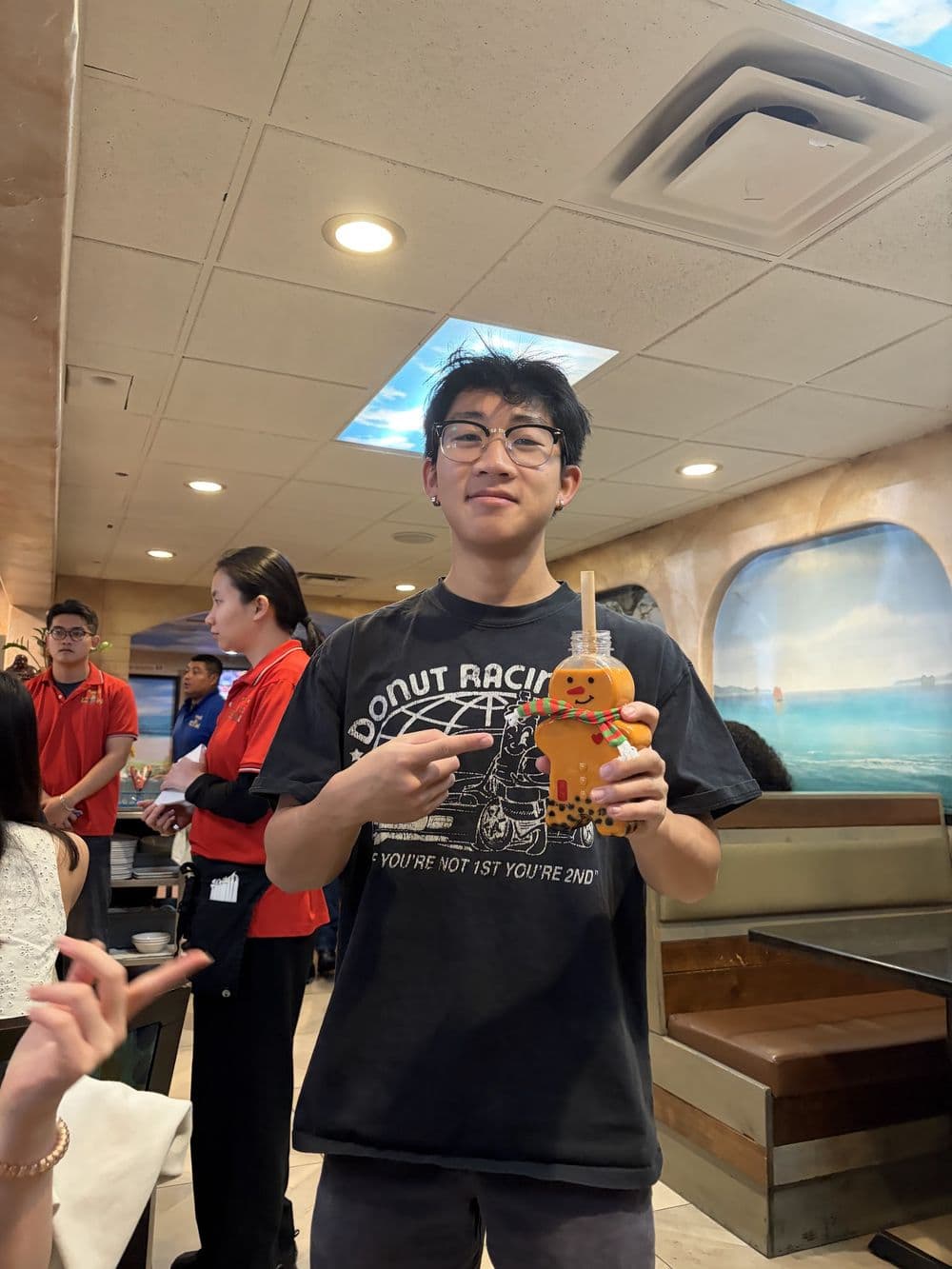 An organizer with a drink at a kickback