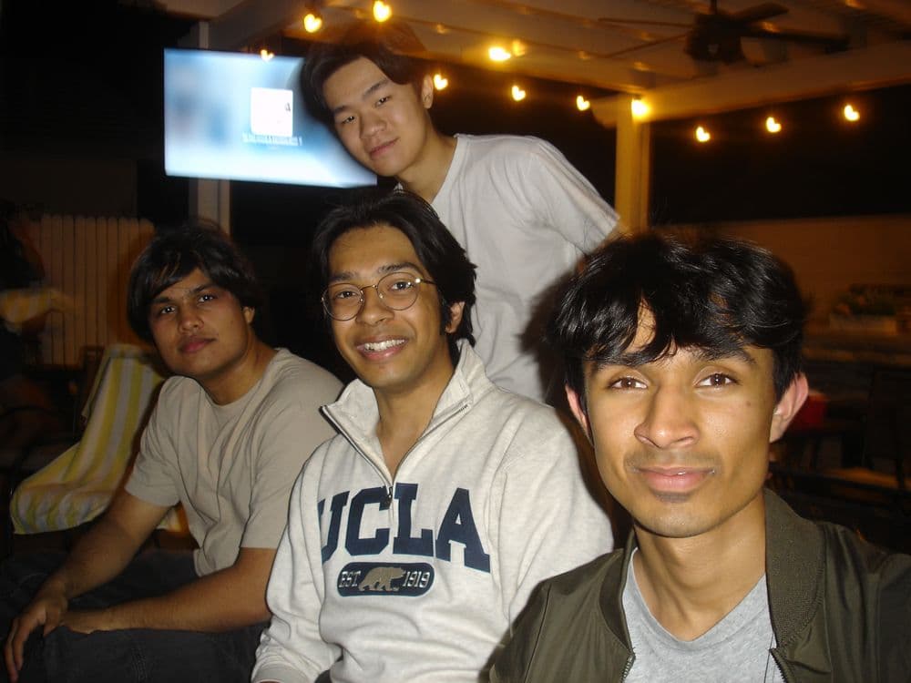 Three organizers at an evening get-together