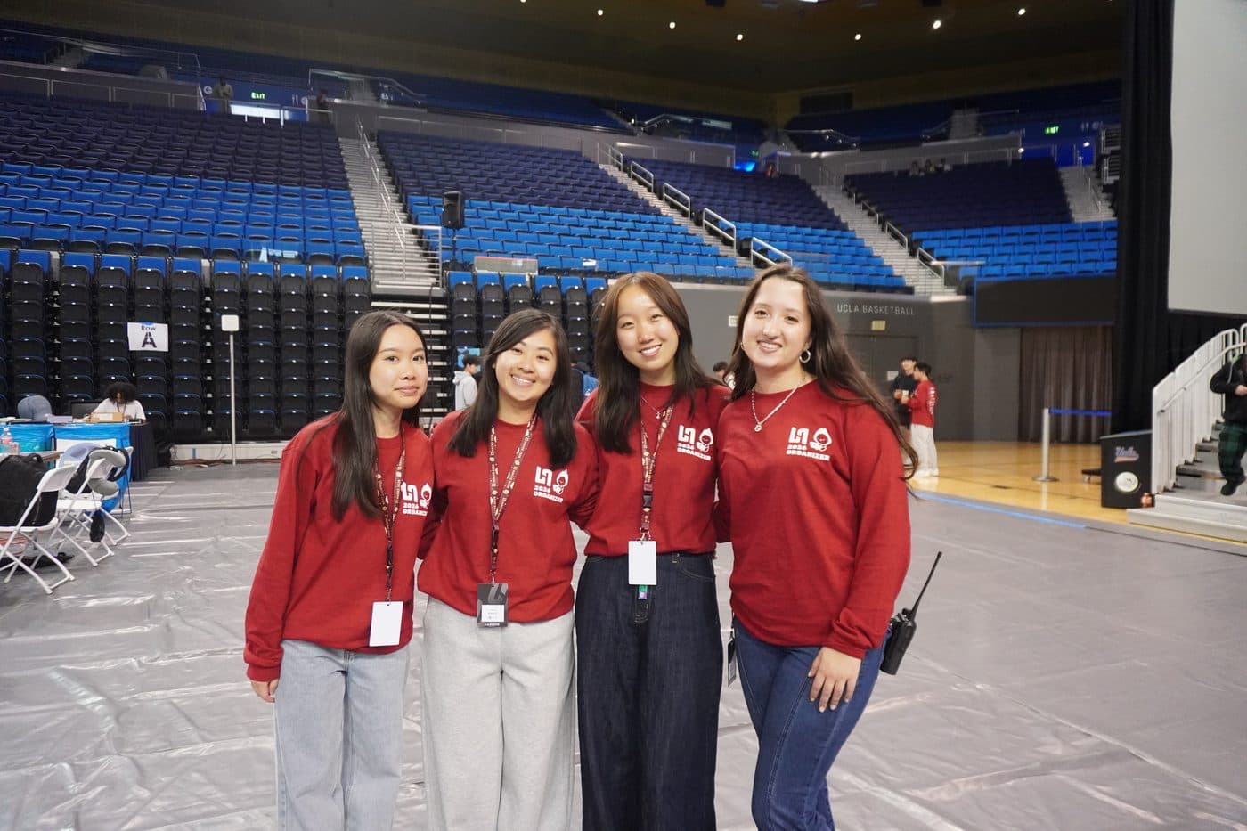 Four LA Hacks organizers courtside at Pauley Pavilion